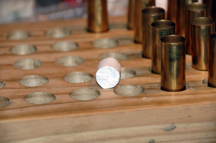 A view of the base of the bullet with patch on.